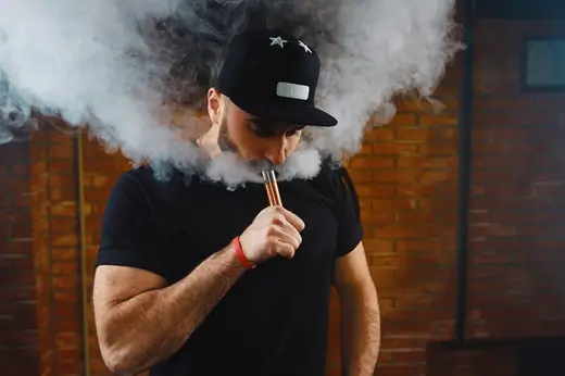 man vaping electronic cigarette